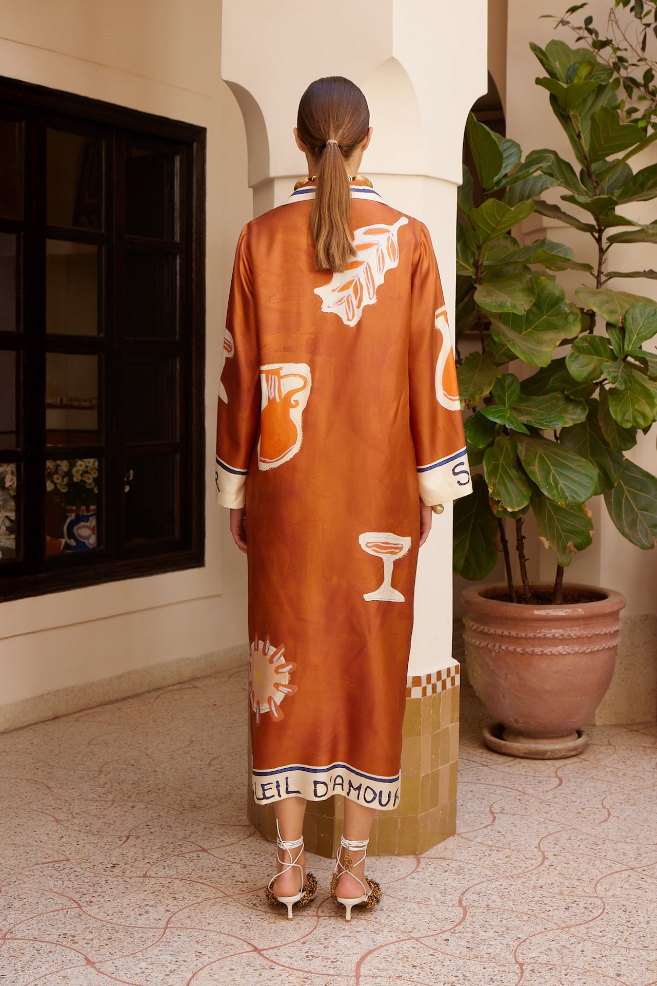 Woman Wearing Alemais Soleil D'amour Silk Shirtdress - Dress LUXAMORE