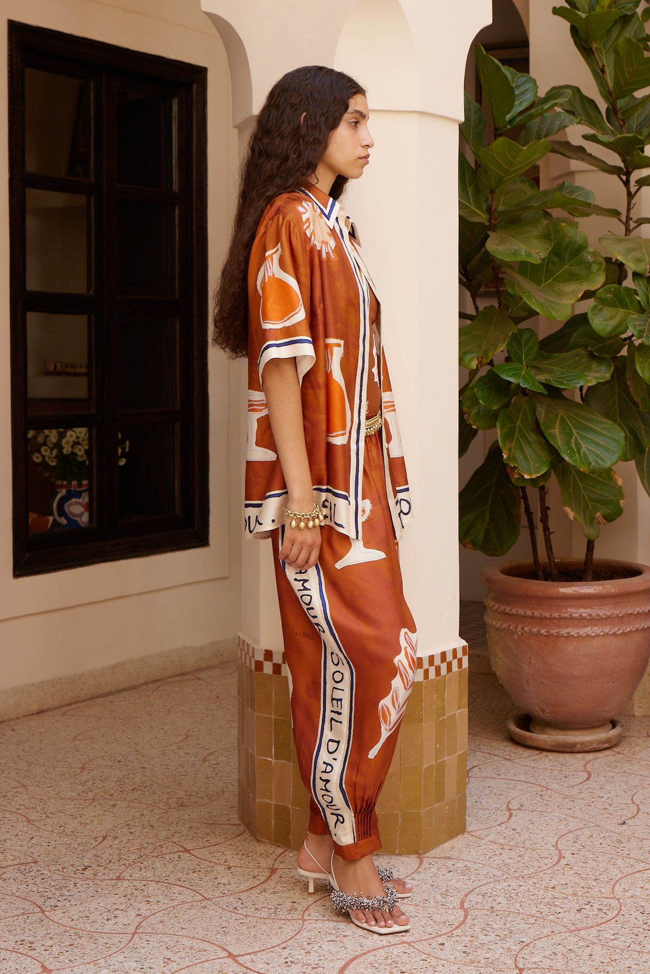 Woman Wearing Alemais Soleil d’Amour Silk Tapered Pants - Pants LUXAMORE