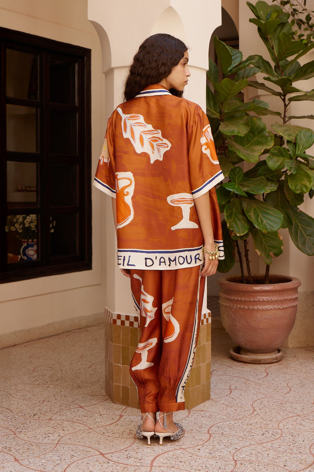 Woman Wearing Alemais Soleil d’Amour Silk Tapered Pants - Pants LUXAMORE