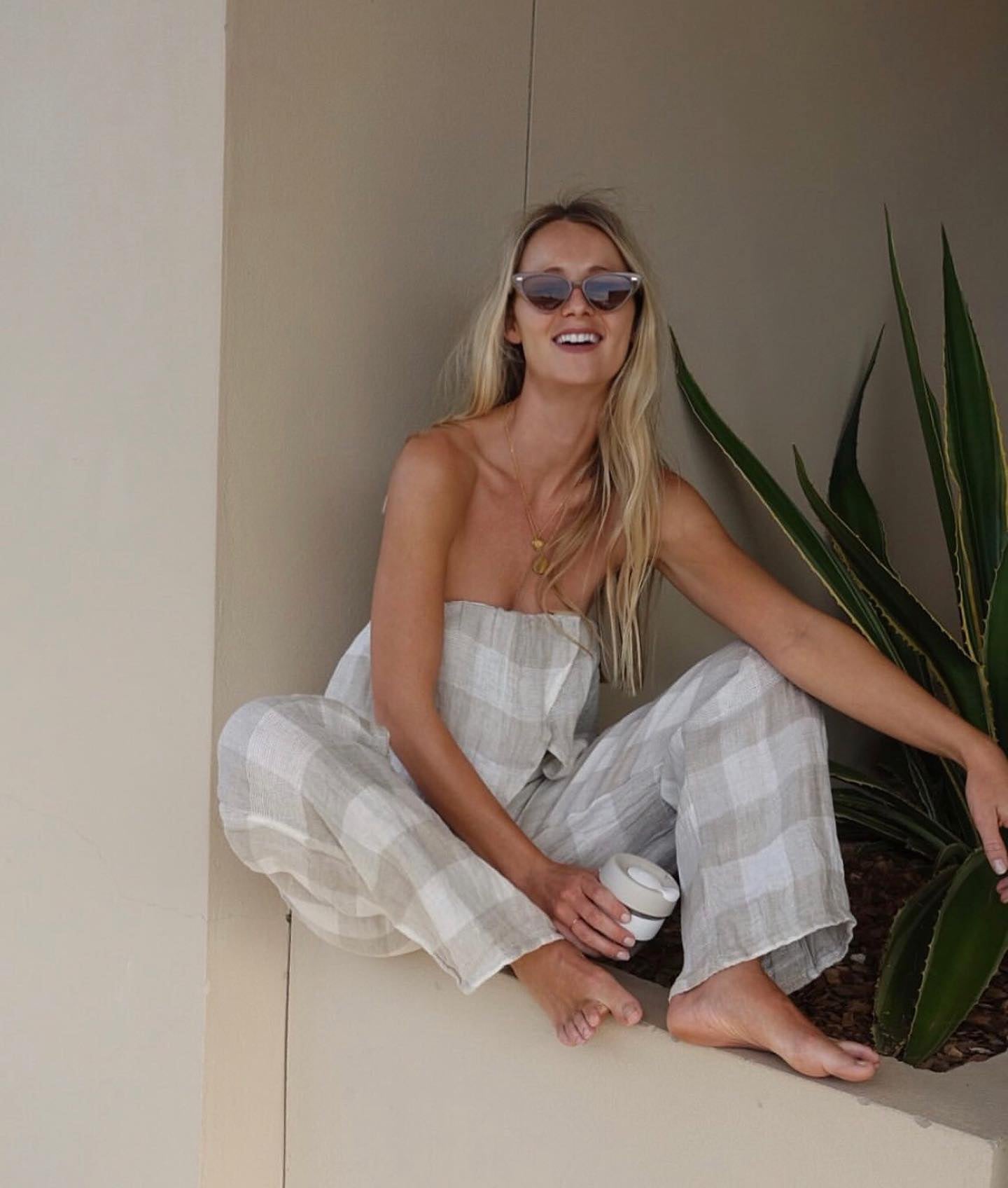 Woman Wearing Estillo Emporio Papillion Jumpsuit - Panna White - Jumpsuits LUXAMORE