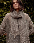 Woman Wearing Estilo Emporio Grand Scarf - Pescatore Natural Chocolate - Scarf LUXAMORE