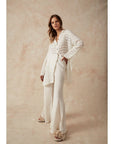 Woman Wearing Estilo Emporio Novo Flare Pant - Brasile Panna White - Pants LUXAMORE