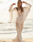 Woman Wearing Estilo Emporio Novo Flare Pant - Brasile Panna White - Pants LUXAMORE