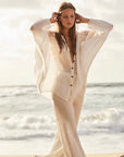 Woman Wearing Estilo Emporio Novo Flare Pant - Brasile Panna White - Pants LUXAMORE