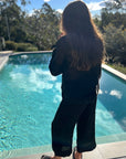 Woman Wearing Estilo Emporio Stevie Top - Black - Tops LUXAMORE
