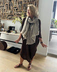 Woman Wearing Estilo Emporio Grand Scarf - Pescatore Natural Chocolate - Scarf LUXAMORE