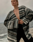 Estilo Emporio Luella Cardigan - Black Multi sustainable knit worn by model at the beach LUXAMORE