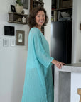 Woman in a modern home wearing estilo emporio dress.