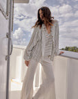 Woman Wearing Estilo Emporio Novo Flare Pant - Brasile Panna White - Pants LUXAMORE