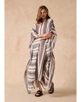 Woman Wearing Estilo Emporio Polla Maxi Kaftan Dark Chocolate Stripe - Dress LUXAMORE