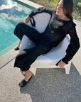 Estilo Emporio Stevie Top - Black worn by model in natural setting LUXAMORE