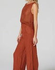 Estilo Emporio Linen Pant Tropez - Rust worn by model in natural setting LUXAMORE