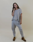 La Bottega di Brunella Pantalone Agathos Linen Pants - Fossil worn by model in natural setting LUXAMORE