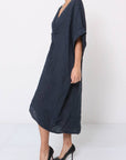 Woman Wearing Linen Dress V-neck Knot Front Midi Made in Italy Navy - Dress LUXAMORE