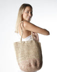 Made in Mada Bag Alice MM worn by model in natural setting LUXAMORE