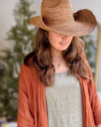 Woman Wearing Made in Mada Hat AZIZ - hat LUXAMORE