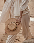 Woman Wearing Made in Mada Hat Gaston - hat LUXAMORE