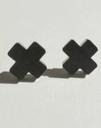 Woman Wearing Mingled Black Cross Stud Earrings - Small Cross Earrings, Minimalist - Earings LUXAMORE