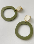 Woman Wearing Mingled Charlie Olive Green and Gold Dangle Earrings - Earings LUXAMORE