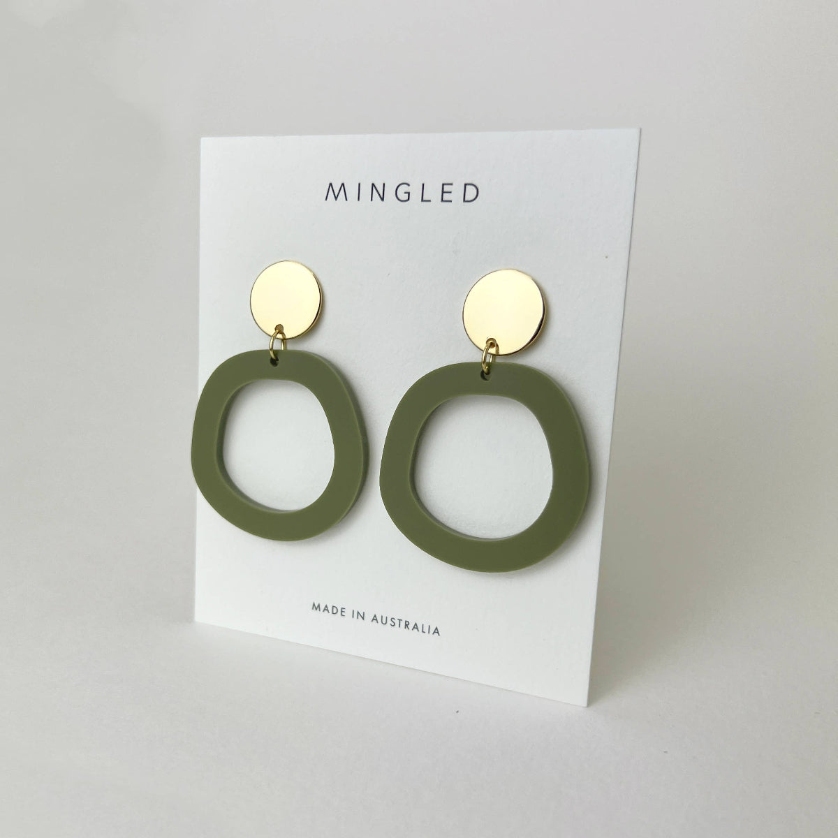 Woman Wearing Mingled Charlie Olive Green and Gold Dangle Earrings - Earings LUXAMORE
