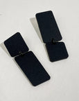 Mingled Dangle Earrings in Black Bauhaus Asymmetrical worn by model in natural setting LUXAMORE