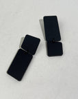 Mingled Dangle Earrings in Black Bauhaus Asymmetrical worn by model in natural setting LUXAMORE