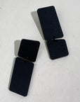 Mingled Dangle Earrings in Black Bauhaus Asymmetrical worn by model in natural setting LUXAMORE