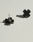 Woman Wearing Mingled Black Cross Stud Earrings - Small Cross Earrings, Minimalist - Earings LUXAMORE