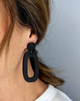 Woman Wearing Mingled Riley Matte Black Statement Earrings - Earings LUXAMORE