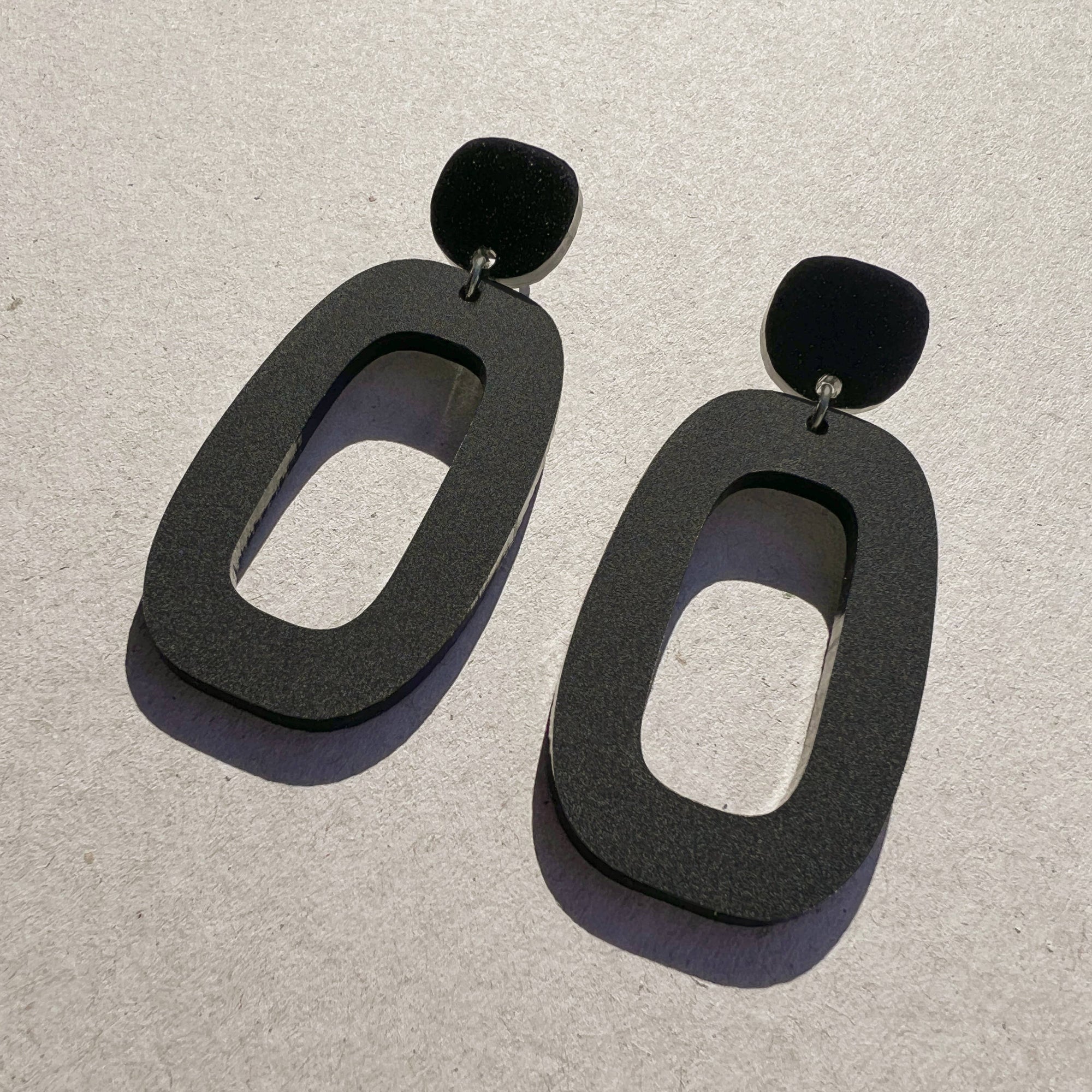 Woman Wearing Mingled  Riley Matte Black Statement Earrings - Earings LUXAMORE