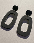 Woman Wearing Mingled Riley Matte Black Statement Earrings - Earings LUXAMORE
