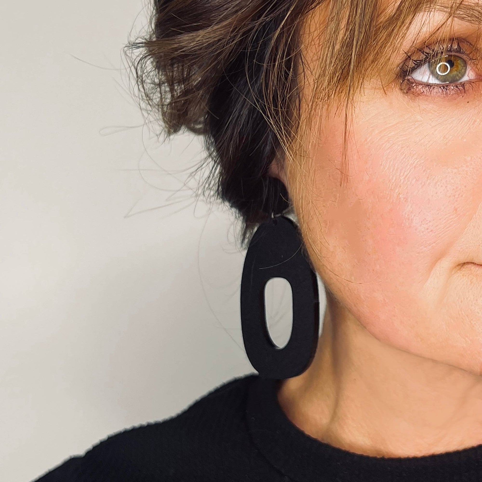 Woman Wearing Mingled Soko Large Matte Black Statement Earrings - Earings LUXAMORE