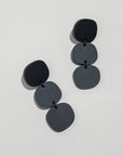 Mingled Statement Earrings - Black Triple Stack worn by model in natural setting LUXAMORE