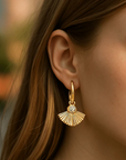Orna Curio Fan Mail Gold Earrings - LUXAMORE -Earings-Gold Plated Earrings Introducing our Fan Mail Earrings, crafted with 18k gold plating and intricate fan carvings accented by a sparkling cubic zirconia centerpiece. Materials: 18k Gold Plated Stainless Steel Dimensions: 2.8cm x 2cm