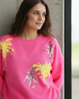 Pre Order Miss Goodlife Roundneck Palmtree Paillette Sweater worn by model in natural setting LUXAMORE