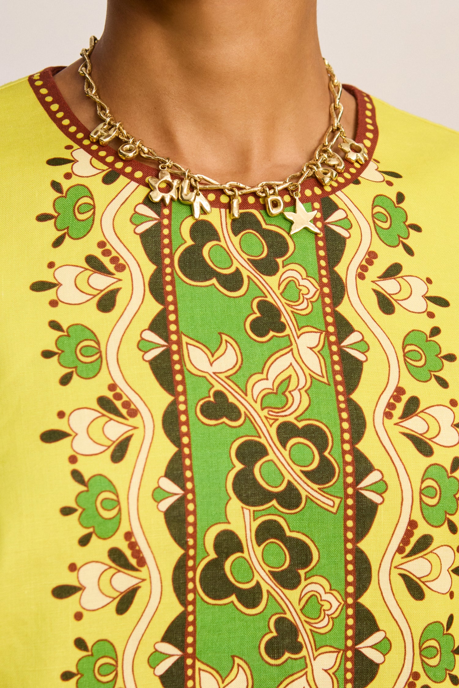 Alemais Bridgette Mini Dress close up showcasing the custom print design, neckline details.. LUXAMORE.