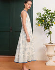 Premium European linen midi: ALÉMAIS Lucky Lace Up Midi Dress in ivory white linen featuring an elegant high neck design.. LUXAMORE