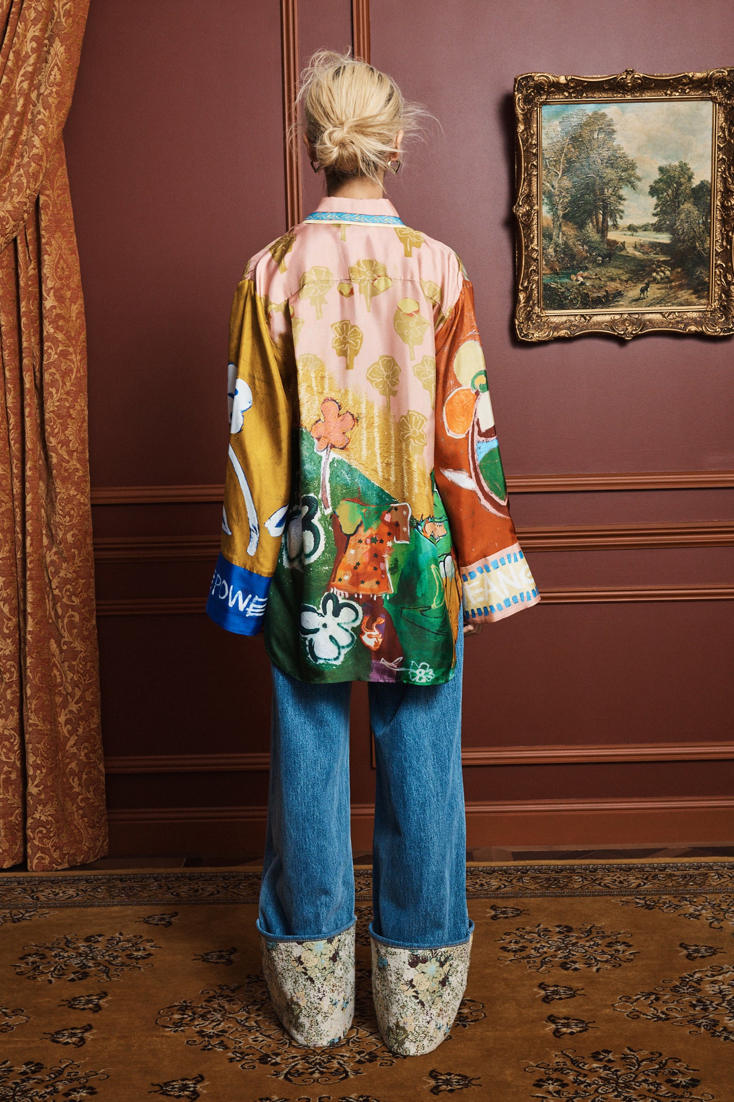 Relaxed fit silk shirt: ALÉMAIS MLAK graphic print top showing full-length sleeves with deep cuffs and side splits.