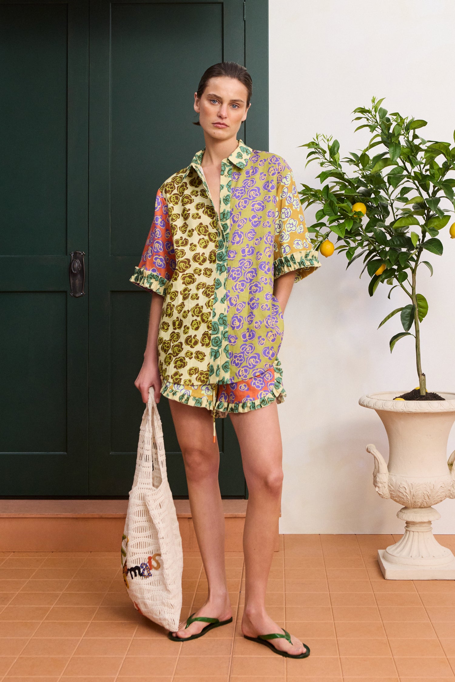 Alemais Patty Spliced Shirt in multi-color linen hemp print – Front view on model showcasing the pointed collar, structured stand, and concealed button placket.. LUXAMORE