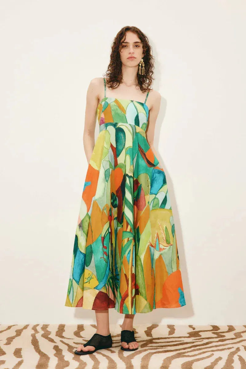 Designer linen sundress: ALÉMAIS Mokshini Sundress showing the smocked elastic back panel and adjustable shoulder straps. LUXAMORE