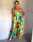 Linen printed maxi dress: ALÉMAIS Mokshini Sundress in a vibrant tropical print featuring a classic square neckline.. LUXAMORE