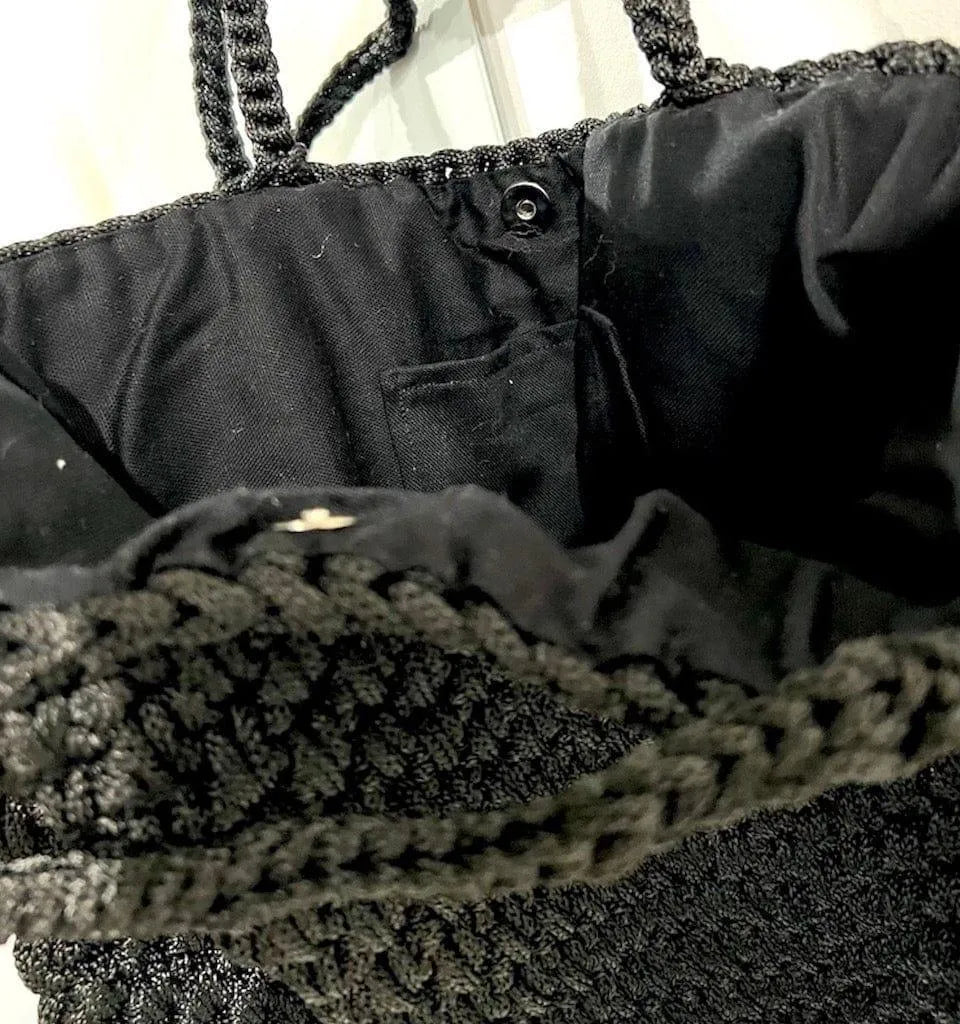 CDC Crochet Bag - Black worn by model in natural setting LUXAMORE 