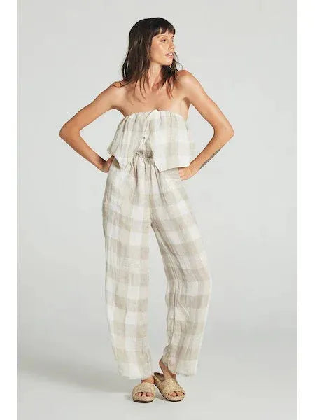 Estillo Emporio Papillion Jumpsuit - Panna White worn by model in natural setting LUXAMORE 