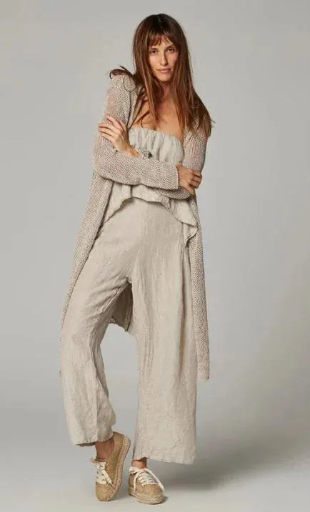 Estillo Emporio Papillion Jumpsuit - Panna White worn by model in natural setting LUXAMORE 