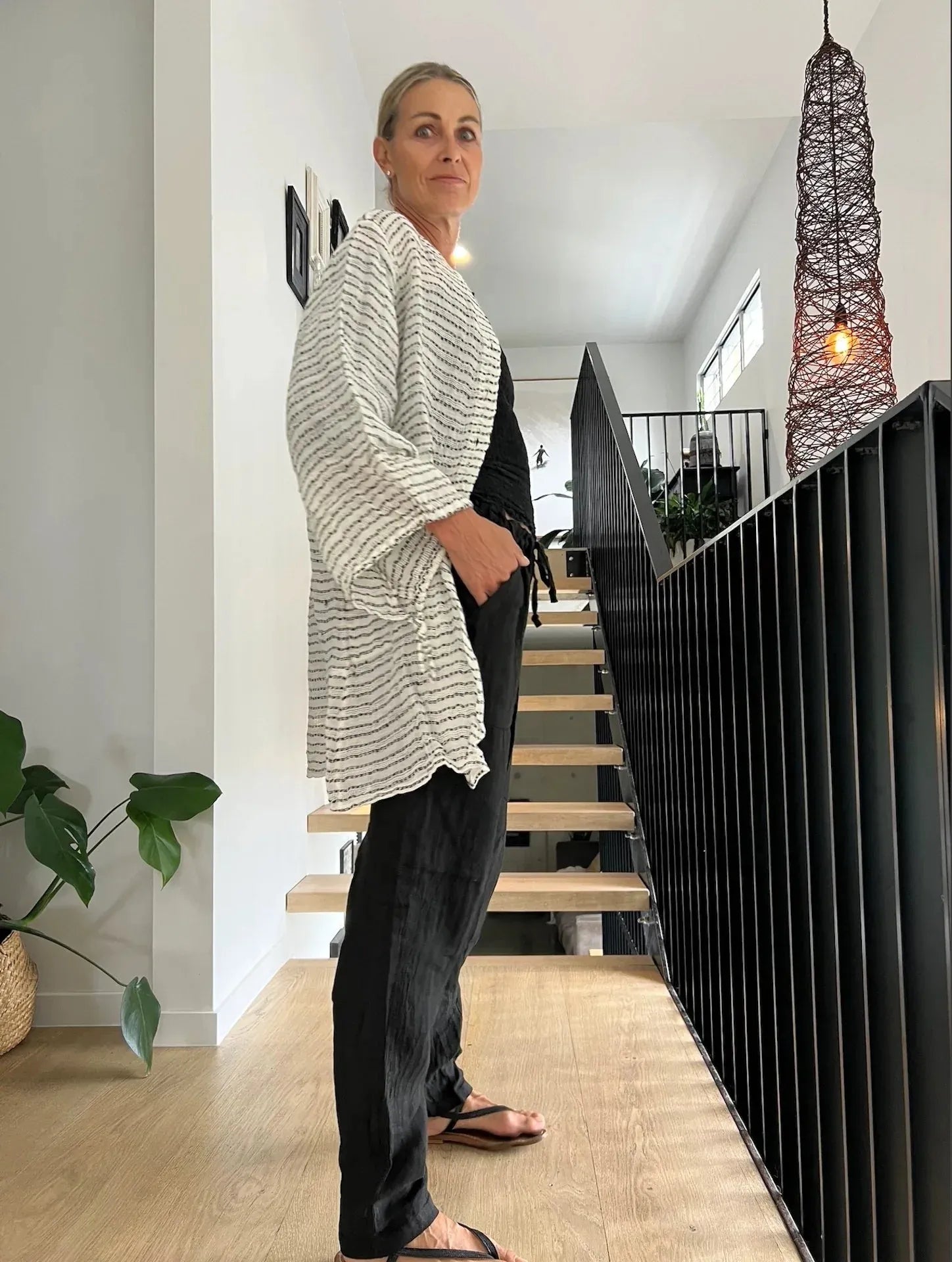 Estilo Emoporio Manta Mini Linen Dress worn by model in natural setting LUXAMORE 