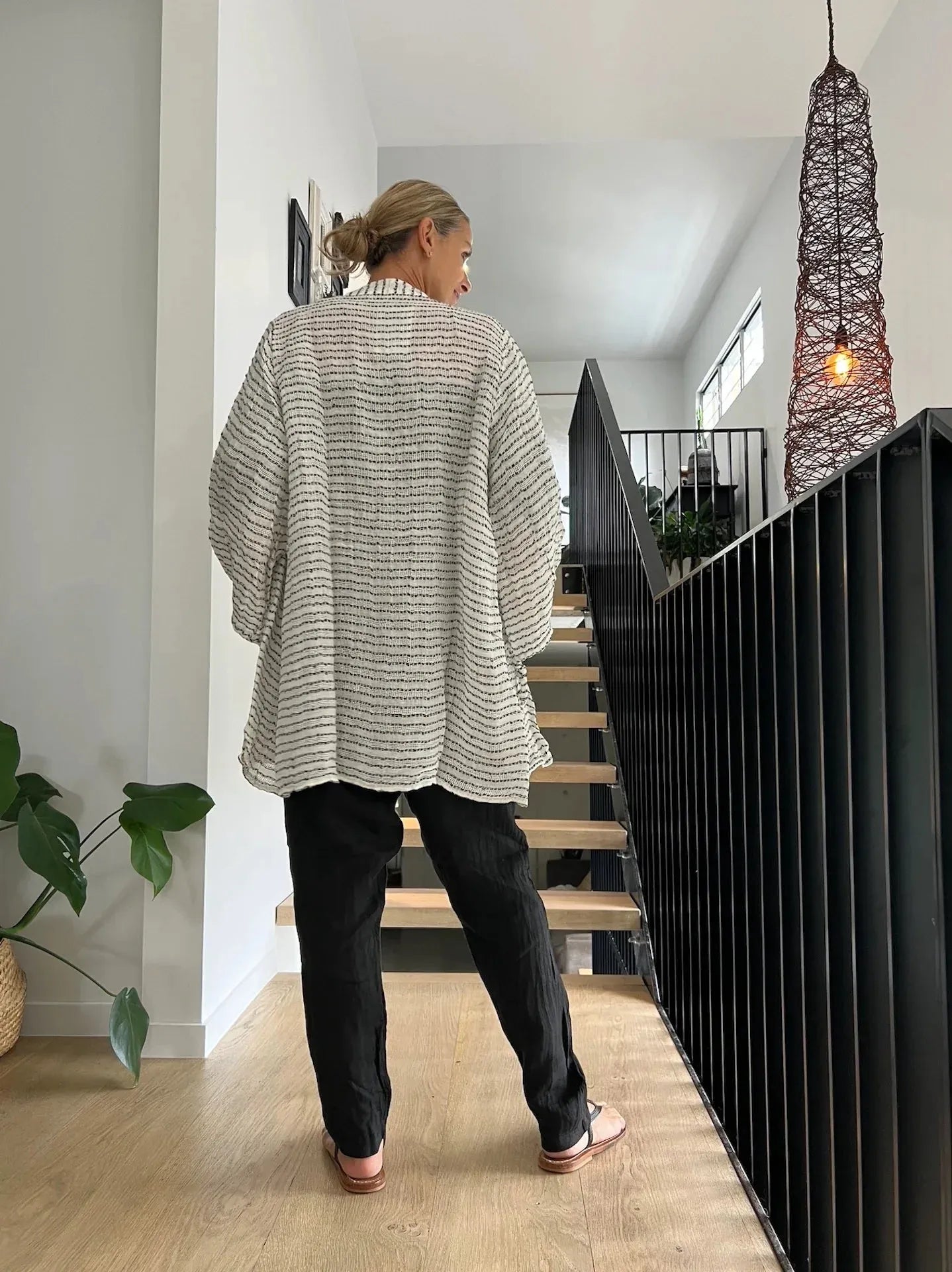 Estilo Emoporio Manta Mini Linen Dress worn by model in natural setting LUXAMORE 