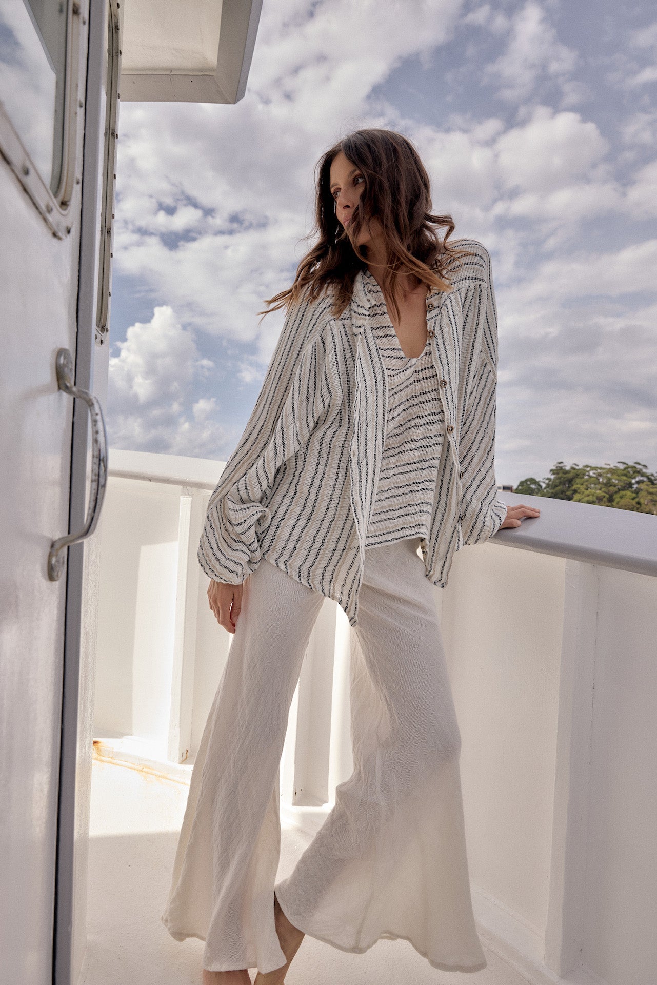 Woman Wearing Estilo Emporio Novo Flare Pant - Brasile Panna White - Pants LUXAMORE
