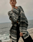 Estilo Emporio Luella Cardigan - Black Multi sustainable knit worn by model at the beach LUXAMORE  