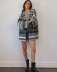 Estilo Emporio Luella Cardigan - Black Multi sustainable knit worn by model in studio LUXAMORE  