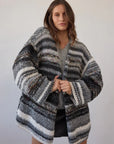 Estilo Emporio Luella Cardigan - Black Multi sustainable knit worn by model in studio LUXAMORE  